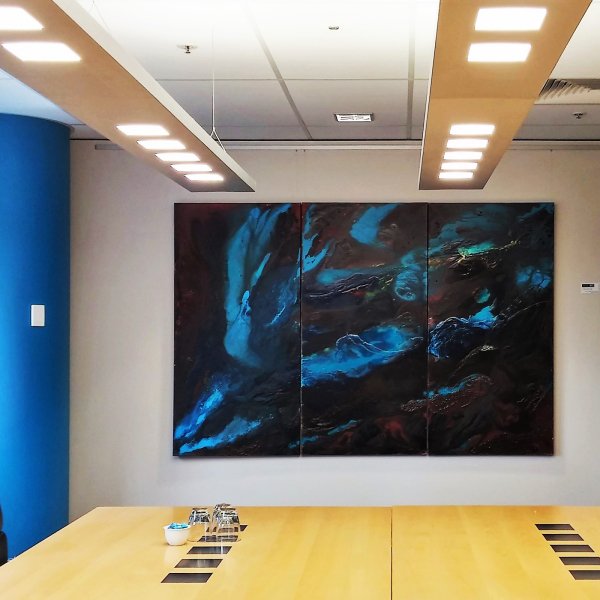 Large blue abstract triptych hung on perlon wires from brushed aluminium ArtiTeq Click Rail picture rail in boardroom
