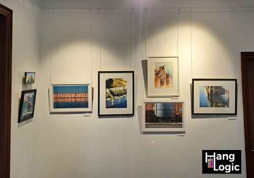 Artiteq Perlon & Loop and Gallery hook supporting Framed Art on Timber Rail Framed artworks displayed using Artiteq Perlon & Loop system on a Victorian-style timber picture rail at Hang Logic.