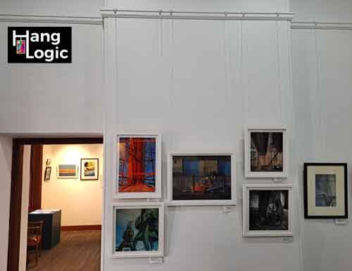 Artiteq Perlon & Loop and gallery hook supporting the Framed Art on Victorian Timber Rail Multiple framed artworks displayed with Artiteq Perlon & Loop system on a Victorian-style timber picture rail