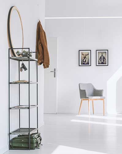 Modern entryway using Artiteq hanging systems available at HANG LOGIC.- heavy mirror requiring mounting,