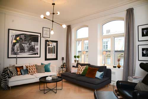 Modern living room featuring Artiteq Click Rail Pro picture rail system from Hang Logic with framed artwork and stylish decor.