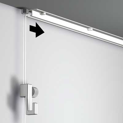 Artiteq Top Rail picture rail system by Hang Logic mounted on a recessed ceiling, showing an invisible hanging mechanism.