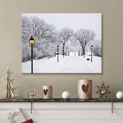 Winter Park Scene Artwork Using Artiteq Picture Rails – Hang Logic Winter scene artwork of snow-covered park with lamp posts and trees, hanging on a wall using Artiteq picture rails, available at Hang Logic.