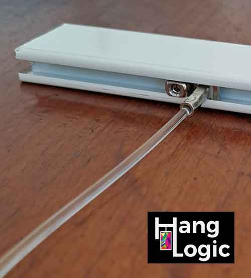 Close-up of a tightened stopper next to a solid slider, preventing it from sliding away.