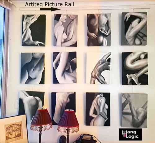 Black and white artistic photos displayed in a grid using Hang Logic picture hanging system