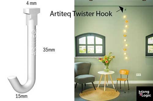 Artiteq Twister picture rail hook displayed with hanging decor in a modern room, featured by Hang Logic.