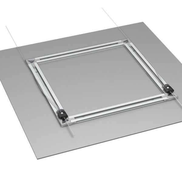 Rear view of aluminium back‑frame rails taped to a flat panel with wires routed through corner slots.