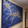 Large blue dot canvas hung on wires from hidden ArtiTeq Shadowline Drywall picture rail in hallway